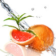Water splash on grapefruit with mint isolated on white