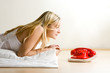 Teenager looking at red phone
