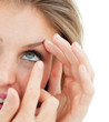 Close-up of a woman putting a contact lens Close-up of a woman putting a contact lens