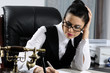 yougn business woman writing