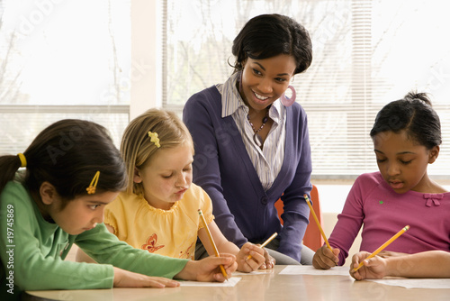Photo: Teacher Helping Students Teacher Helping Students