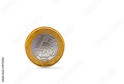 Photo: Single one Brazilian real coin isolated on white background Single one Brazilian real coin isolated on white background
