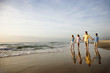Photo: Family Walking on Beach Family Walking on Beach