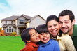 Happy smiling small family in front of house Happy smiling small family in front of house