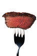 Stück eines gegrilltes Steak auf der Gabel Stück eines gegrilltes Steak auf der Gabel