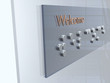 Welcome sign with Braille characters