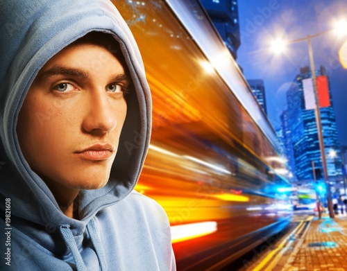 Photo: Handsome young men behind night city Handsome young men behind night city