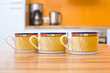Three orange cups