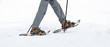 Senior at the snow-shoe walking in winter