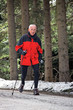 Senior during Nordic Walking in winter