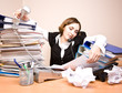 Young businesswoman with tons of documents calling phone