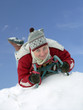Young woman smiling going down the hill belly-flop