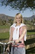 Young woman with mountain bike