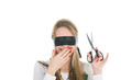 Foto: Girl wearing black band on his eyes and holding scissors Girl wearing black band on his eyes and holding scissors