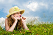 Young girl laying in meadow