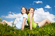 Young girls sitting in meadow