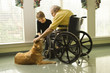 Photo: Elderly Man with Woman Petting Dog Elderly Man with Woman Petting Dog