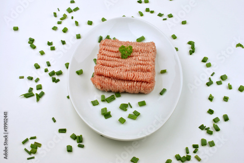 Photo: minced meat with parsley on a plate minced meat with parsley on a plate