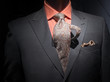 Grey jacket with orange shirt, tie and handkerchief (horizontal)