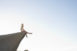 Girl sitting on a rock