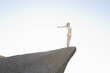 Foto: Model standing on a rock Model standing on a rock