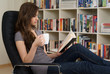 Woman sitting in a chair reading