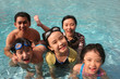 Happy family in the pool