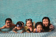 Happy family in the pool