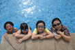 Photo: Mother and kids in the pool Mother and kids in the pool