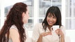 Happy business partners discussing sitting on a sofa