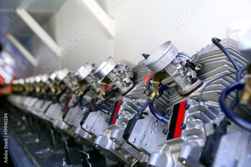 Photo: Engines from kart cars in row line for been inspected Engines from kart cars in row line for been inspected
