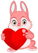 Cute pink bunny holding a heart
