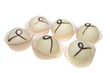 Six white chocolates on a white background
