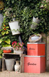 Garden wall with planters and decorative boxes