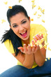 Pretty Young Girl Throwing Popcorn