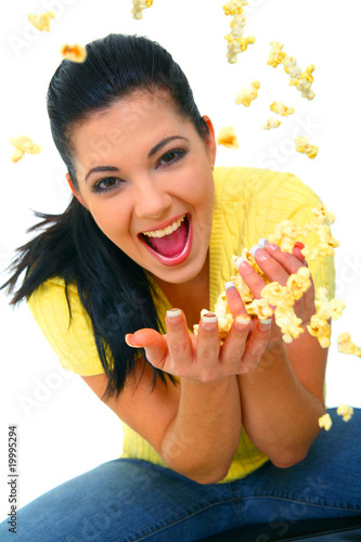 Pretty Young Girl Throwing Popcorn Pretty Young Girl Throwing Popcorn