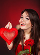 Girl with heart, flower rose on red  background. Valentines Day.