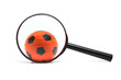 black magnifying glass with soccer ball over white background