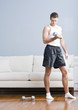 Man Using Arm Weights in Living Room