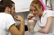 Photo: Couple sharing sodas Couple sharing sodas