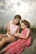 Mother and Daughter Looking at Shells