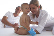 Baby holding feeding bottle