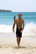 Surfer leaving the water