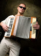 A man plays the accordion A man plays the accordion