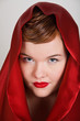 Attractive young woman in red hood