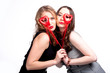 two beautiful girls with red hearts