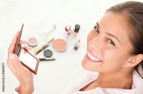 Photo: Putting makeup Putting makeup