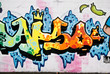 Abstract graffiti on the textured concrete wall