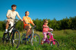 Family go for a drive a sunny day on bicycles