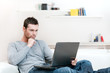 Photo: Man working on laptop Man working on laptop